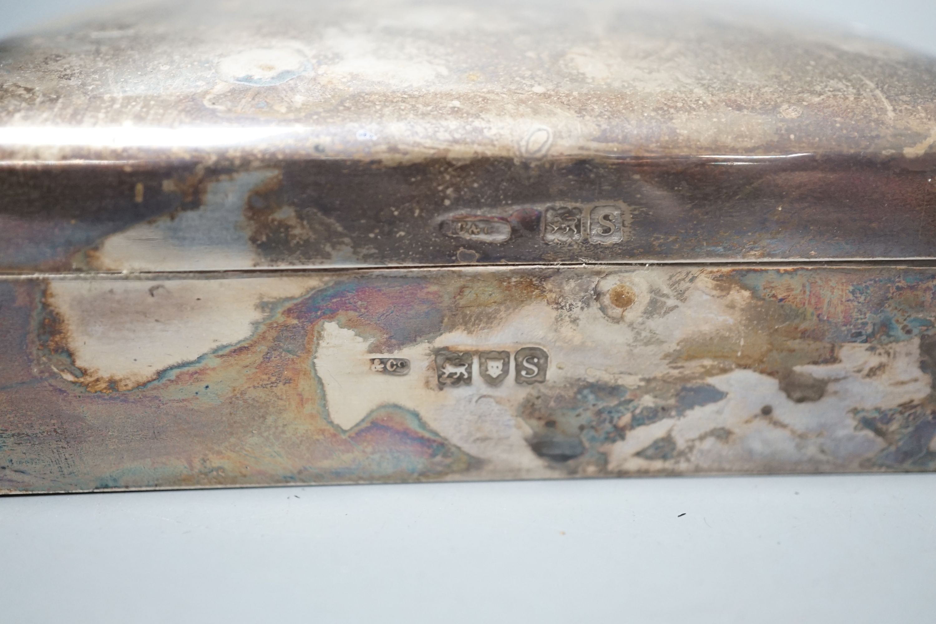 A George V silver mounted cigarette box, London, 1913, 23cm, a Chinese? white metal card case(a.f.) and an Indian? white metal cigarette case.